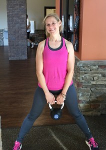 Mary Catherine getting ready to exercise with a kettle bell 