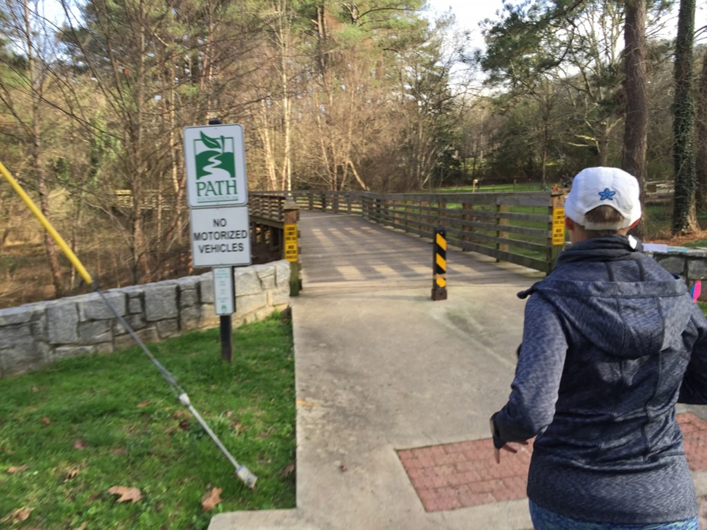Mary Catherine crosses over Willivee Drive and continues along the trail to Medlock Park
